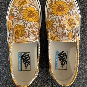 Vans trippy floral slip on shoes.